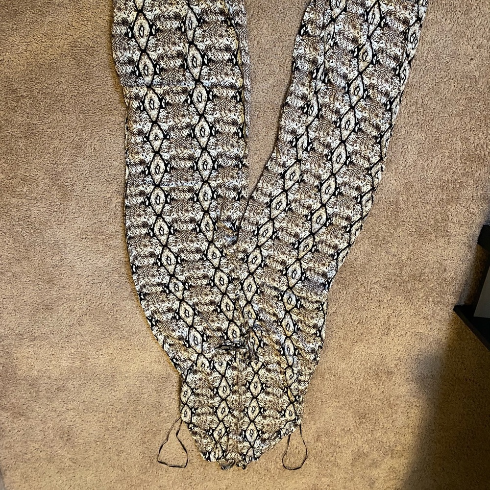 Brand New snake skin romper with an open back 😍